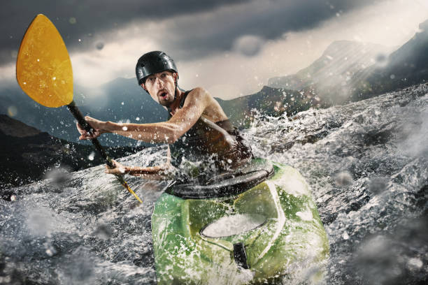 istock Whitewater kayaking, extreme kayaking. A guy in a kayak sails on a mountain river 1070181116