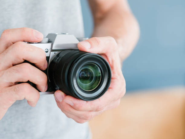 photography equipment technology man hold camera