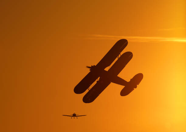 istock Silhouette of vintage single engine propeller biplane flying 1070184900