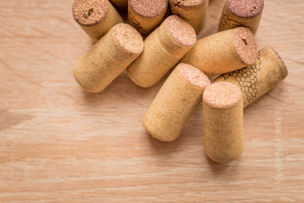 istock pile of used vine corks on wooden background with copy space 1070184912