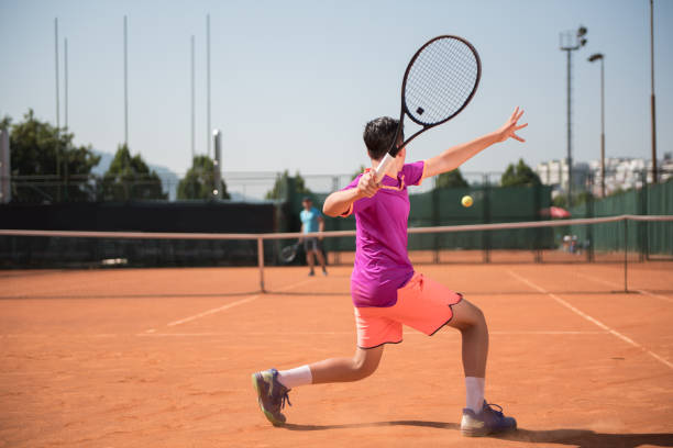 istock Young tennis player playing forehand 1070184950