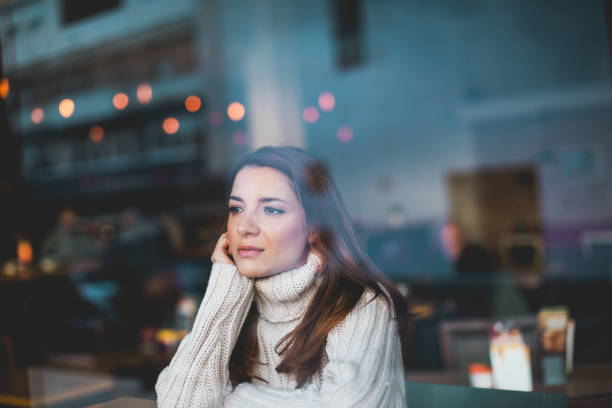 Lonely girl in cafe stock photo