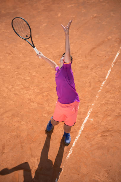 istock Young tennis player serving the ball 1070186038