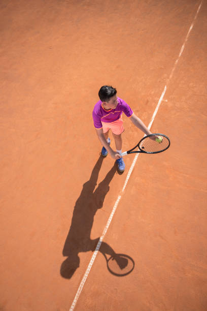 istock Young tennis player prepares for serving the ball 1070186058