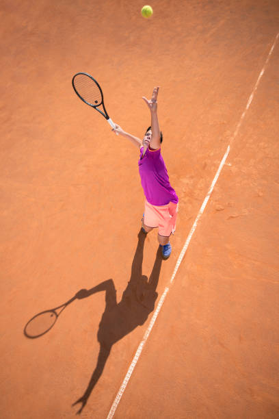 istock Young tennis player serving the ball 1070187136