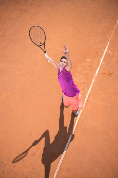 istock Young tennis player serving the ball 1070187142