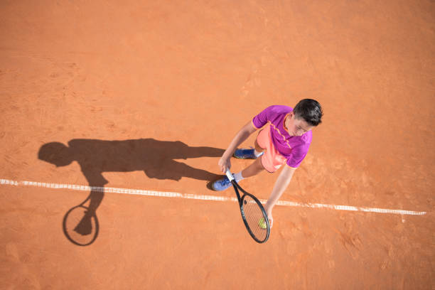 istock Young tennis player prepares for serving the ball 1070187380