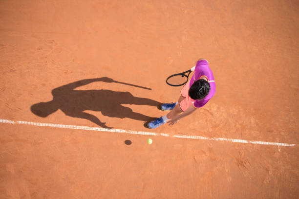 istock Young tennis player prepares for serving the ball 1070187596