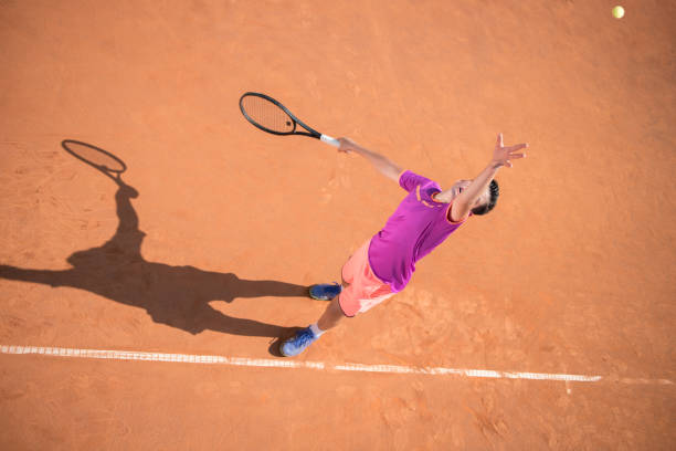 istock Young tennis player serving the ball 1070187626