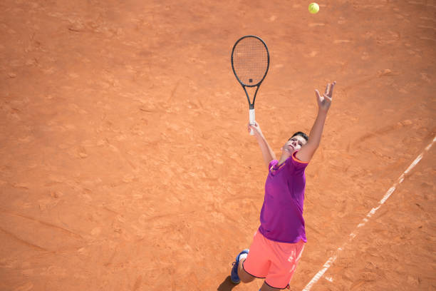 istock Young tennis player serving the ball 1070187820