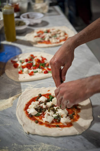 istock Preparing Pizza dought at the pizzeria. 1070194408