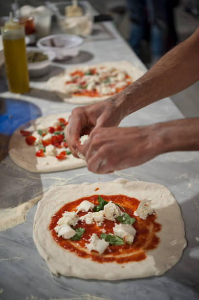 istock Preparing Pizza dought at the pizzeria. 1070194480