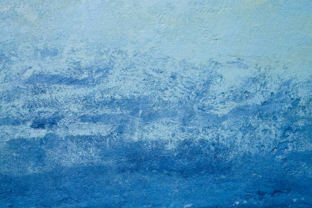 istock Abstract blue texture and background for design. Old wall painted in navy blue and light blue. Close up view of rough blue texture and background. 1070195364