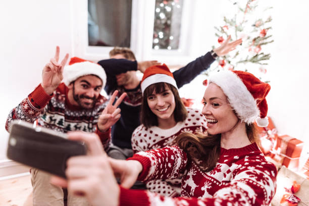 istock friends using smartphones at christmas 1070196502