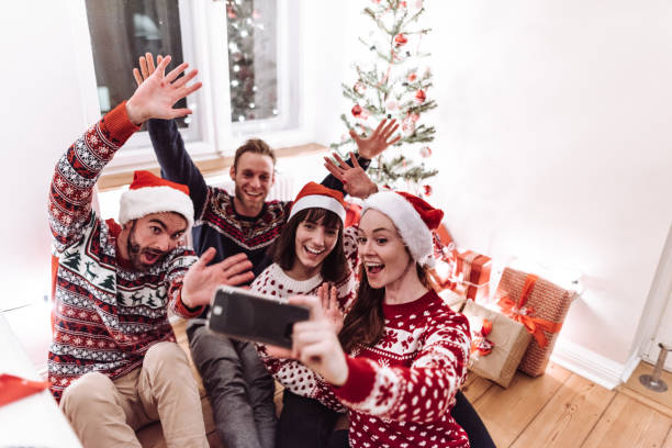 istock friends using smartphones at christmas 1070197752