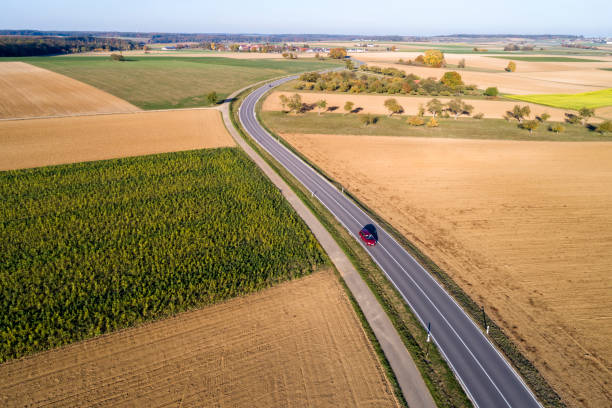 istock Red Car on Coutry Road, Aerial View 1070198246