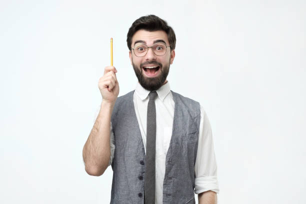 istock Young hispanic man with beard, glasses and pencil has a good idea. 1070198306