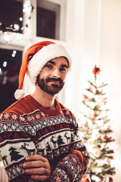istock man standing at home for christmas 1070200606
