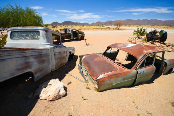 Abandoned vehicles sit in the desert outside Solitaire in Namibia. stock photo