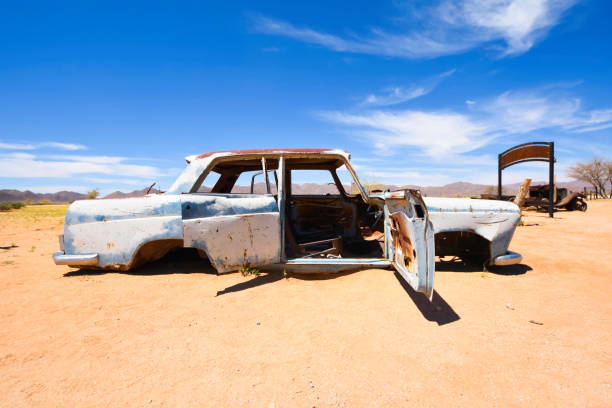 Abandoned vehicles sit in the desert outside Solitaire in Namibia. stock photo