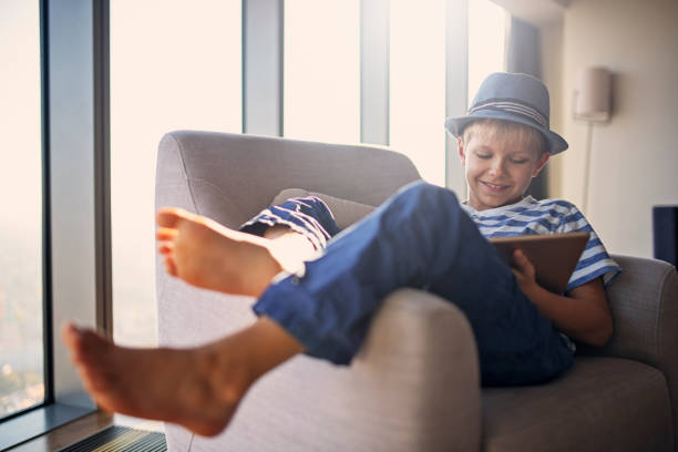Little boy enjoying some time off with his tabletNikon D850