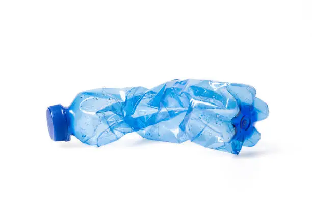 empty plastic waste bottle isolated on white background