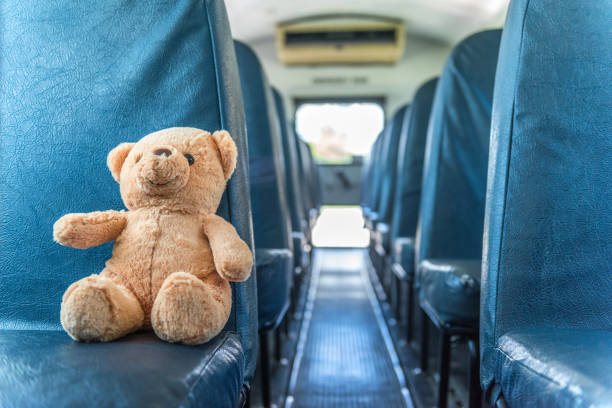 School bus ride Abandoned stuffed toy inside of school bus. empty school bus stock pictures, royalty-free photos & images