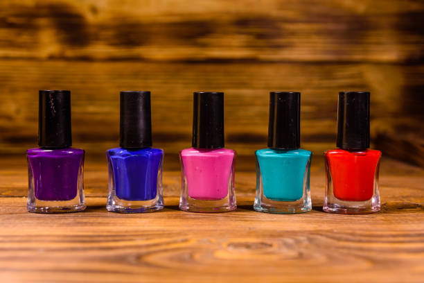 istock Different nail polishes on a wooden table 1070207620