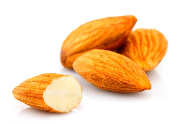 istock Closeup of almonds, isolated. 1070225336