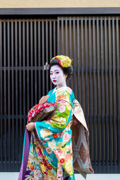 istock Maiko Apprentice Geisha looking at camera with strong eyes 1070225406