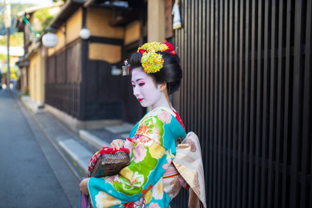 istock Maiko Apprentice Geisha looking over shoulder on street 1070229154