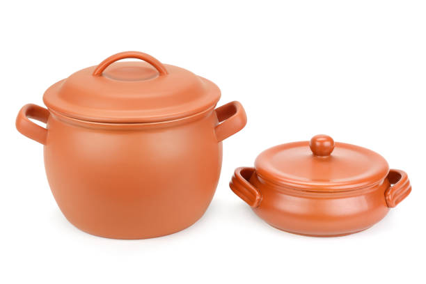 istock Two clay pots with lids isolated on white 1070229238