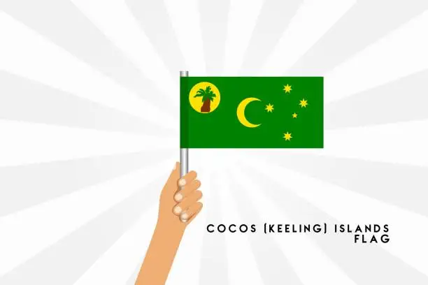 Vector illustration of Vector cartoon illustration of human hands hold Cocos İsland flag. Isolated object on white background.