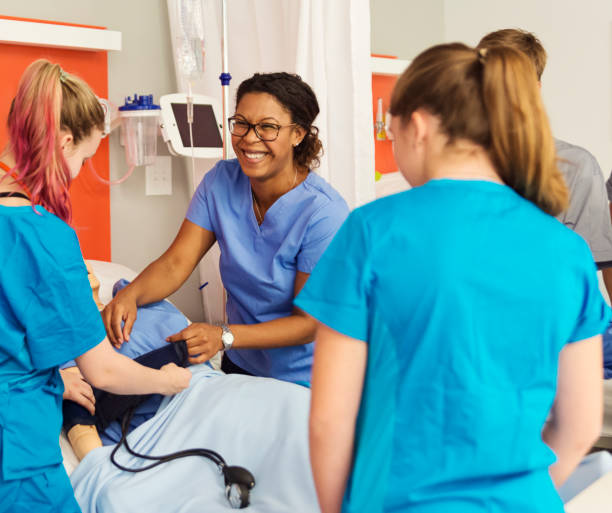 Multi-ethnic group of students in college nursing class.