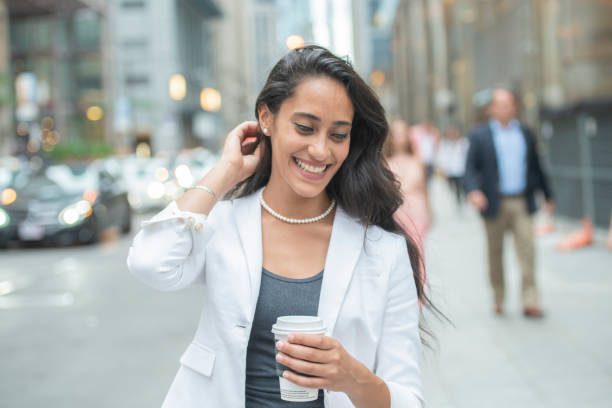 istock Business woman walking with drink 1070237178