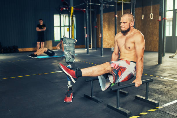 istock Sportsman with prosthesis working out in gym 1070237922