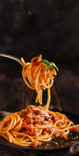 Spaghetti pasta with bolognese sauce Spaghetti pasta with bolognese sauce with a fork close up bolognese sauce photos stock pictures, royalty-free photos & images