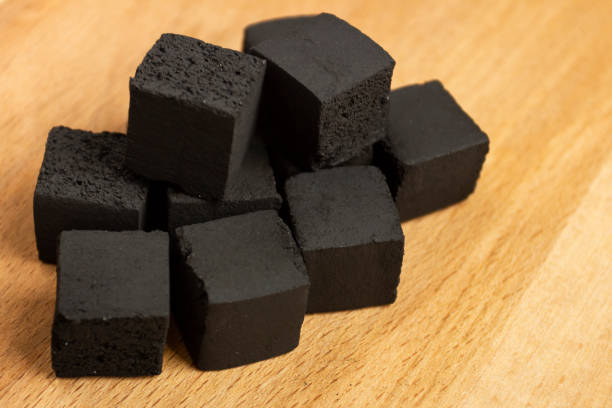 istock Coconut coals for hookah cubes on wooden background 1070240920