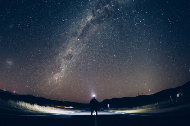 istock Silhouetted man under the milky way. 1070247700