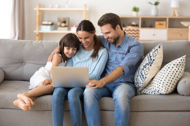 istock Family spend free time at home surfing internet 1070261820