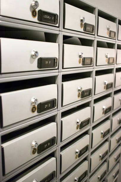 istock Residential appartment block building interior letter boxes with numbers. 1070266640