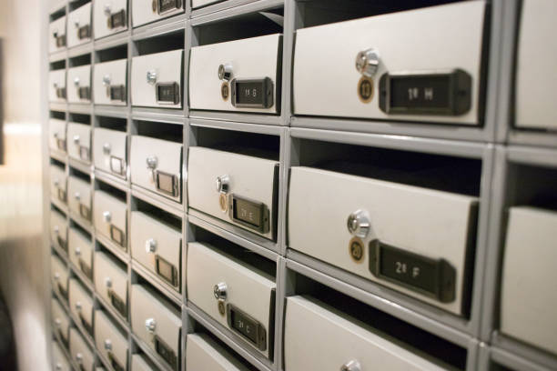 istock Residential appartment block building interior letter boxes with numbers. 1070266792