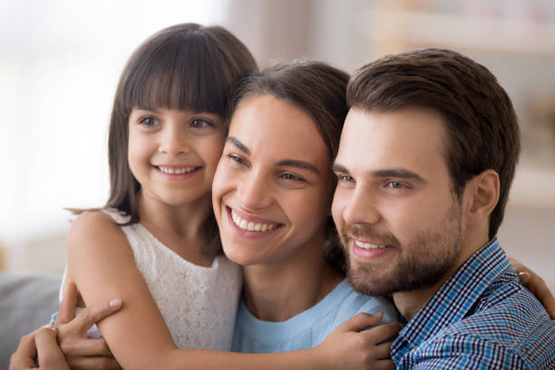 istock Diverse family with little daughter looking at camera 1070267300