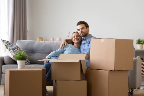istock Diverse family sitting on couch at new home 1070267444