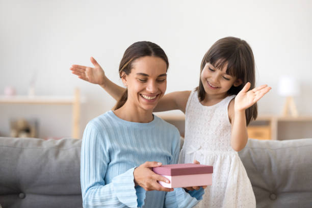 istock Mother receive from small daughter a gift 1070267544