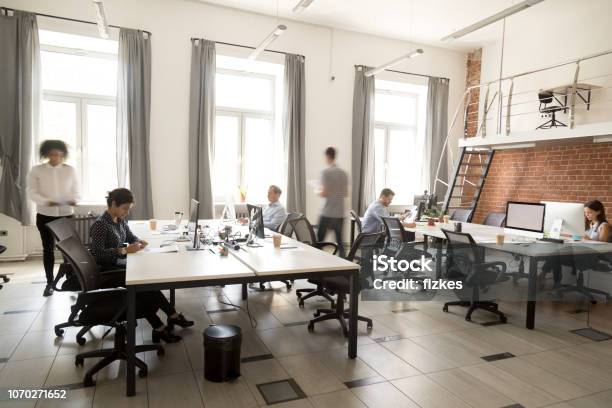 Corporate Staff Employees Working Together Using Computers At Coworking Stock Photo - Download Image Now