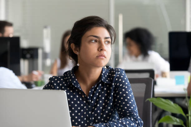 istock Thoughtful indian businesswoman looking away thinking of problem solution 1070271670