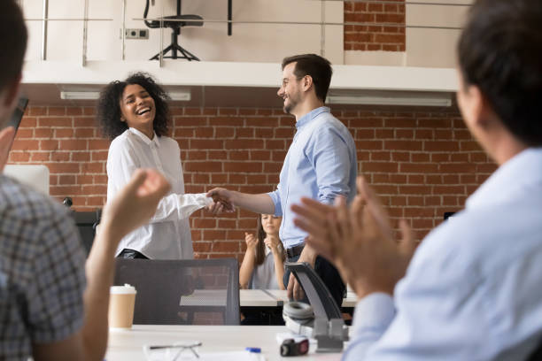 istock Happy ceo team congratulating successful african worker with job promotion 1070271672