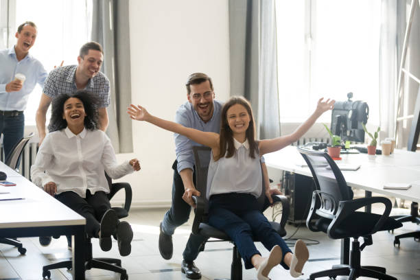 istock Excited carefree diverse office workers having fun during work break 1070271752