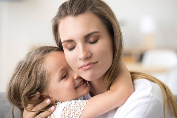 istock Loving small daughter hug young mom enjoying moment 1070271978